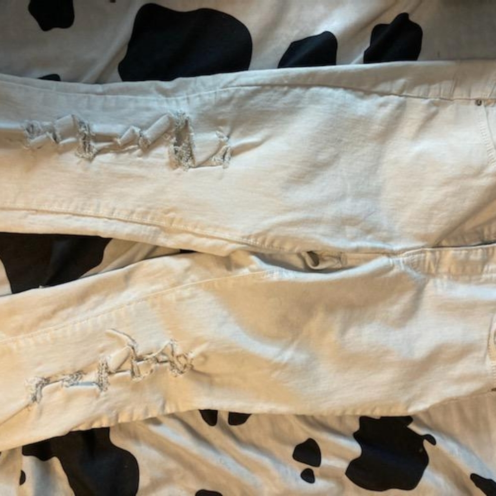 Off white distressed butt wax jeans